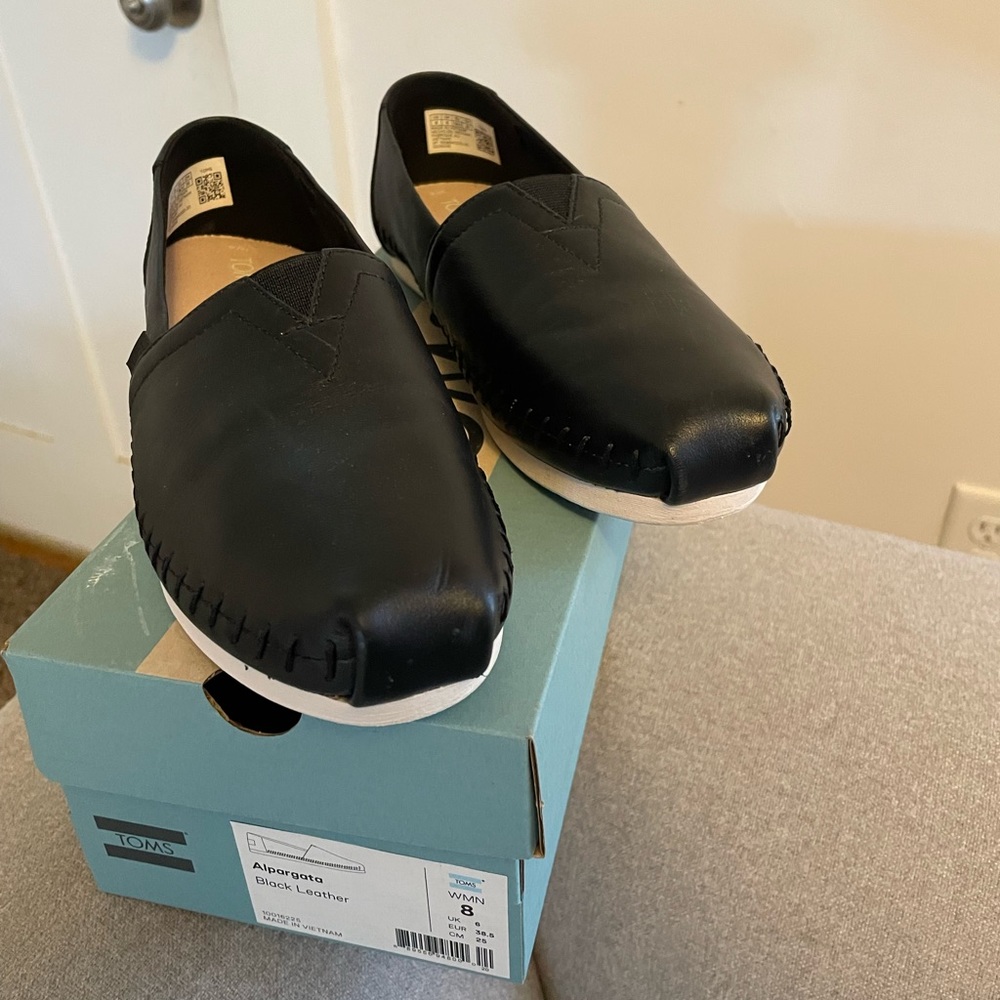 Black leather Toms